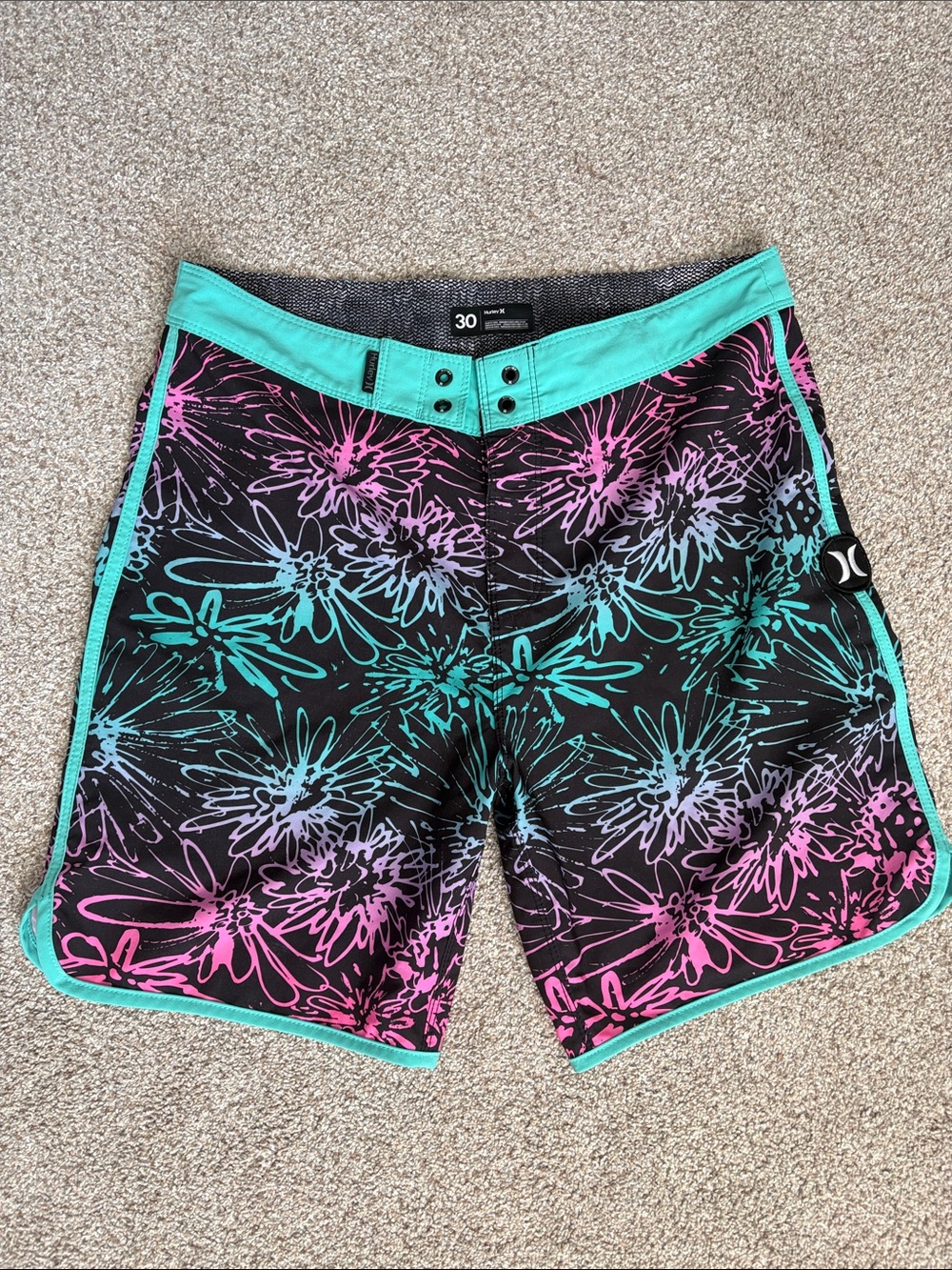 Hurley Black Board Shorts with Teal Waistband and Pink Floral Accent